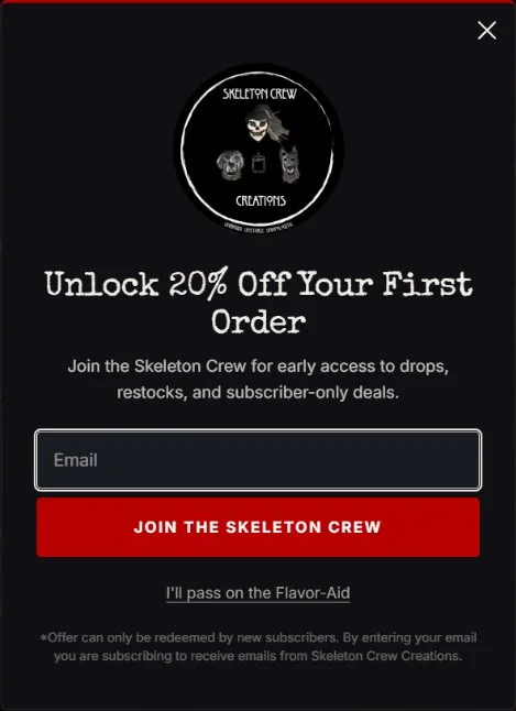 Email popup, signup modal, new site, desktop view. A dark card with a red top rule, Special Elite headline, Inter body, dark email field, red 'Join the Skeleton Crew' button and an underlined 'I'll pass on the Flavor-Aid' link.