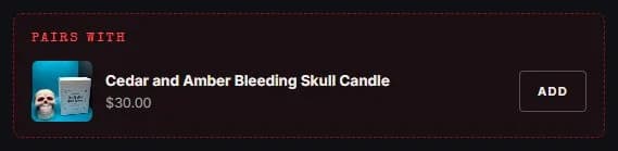 Product page: room and linen spray, pairs with add-on, new site, desktop view. With the Cedar and Amber spray selected, a 'Pairs with' slot offers the Cedar and Amber Bleeding Skull Candle ($30) with an Add button.